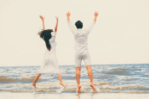 istock Couple going honeymoon on tropical beach in summer 1008215372