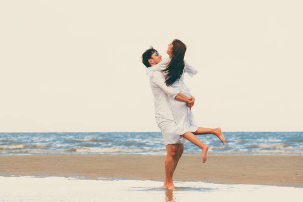 istock Couple going honeymoon on tropical beach in summer 1008215374