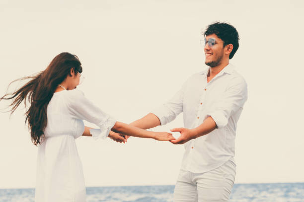 istock Couple going honeymoon on tropical beach in summer 1008215384