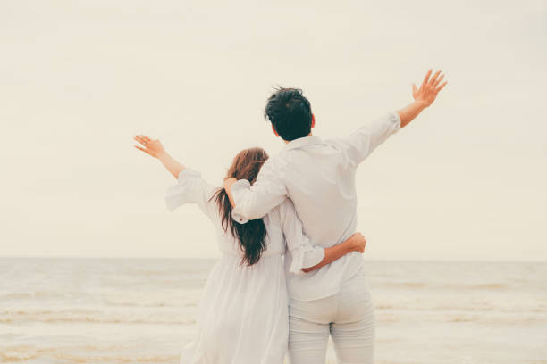 istock Couple going honeymoon on tropical beach in summer 1008215416