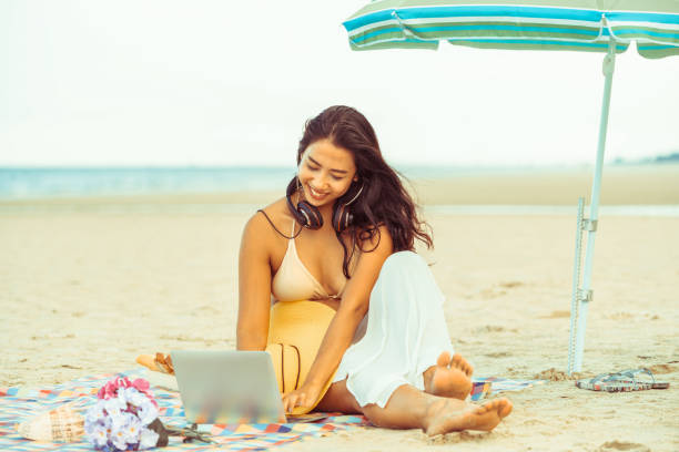 istock Plus size young woman sitting on the beach. 1008215706