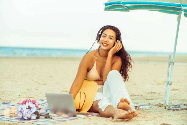 istock Plus size young woman sitting on the beach. 1008215728