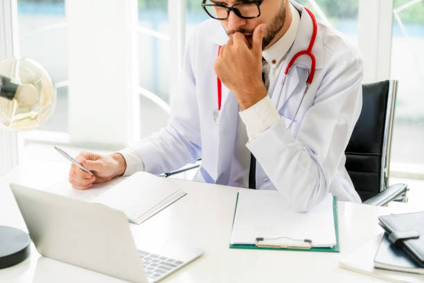 istock Doctor working on laptop computer hospital. 1008220240