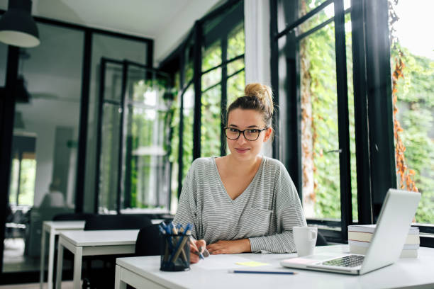 istock College student studying in the university library or study room. Looking at camera. 1008220414