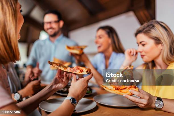 Closeup Image Of Group Of Friends Or Colleagues Eating Pizza Stock Photo - Download Image Now