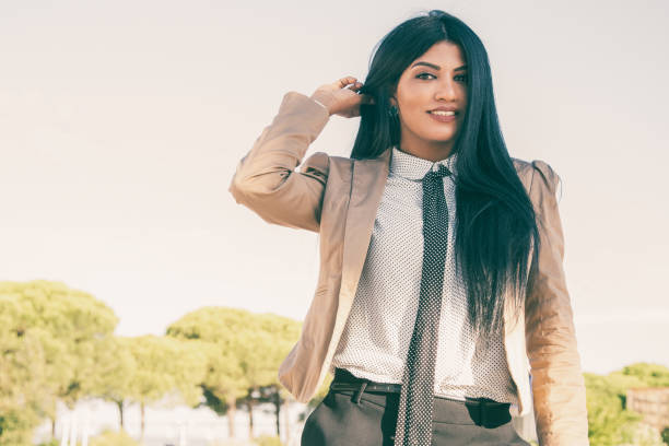 istock Cheerful successful business lady walking in park 1008228974