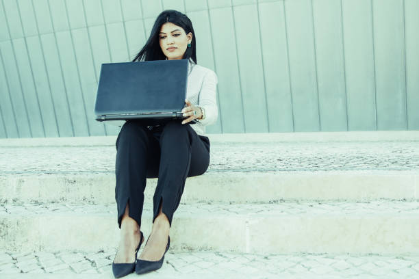 istock Successful female entrepreneur working on laptop 1008229082