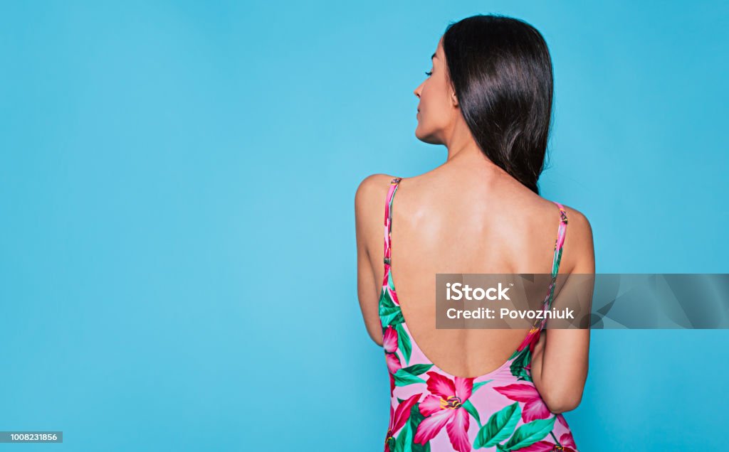 Rear View Photo Of Cute Brunette Woman In Summer Dress Posing On Blue  Background Stock Photo - Download Image Now - iStock