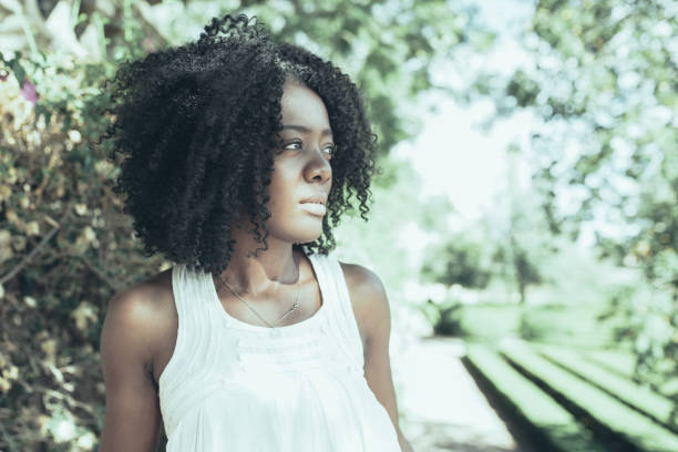 istock Pensive Young Black Woman Walking in Park 1008234778