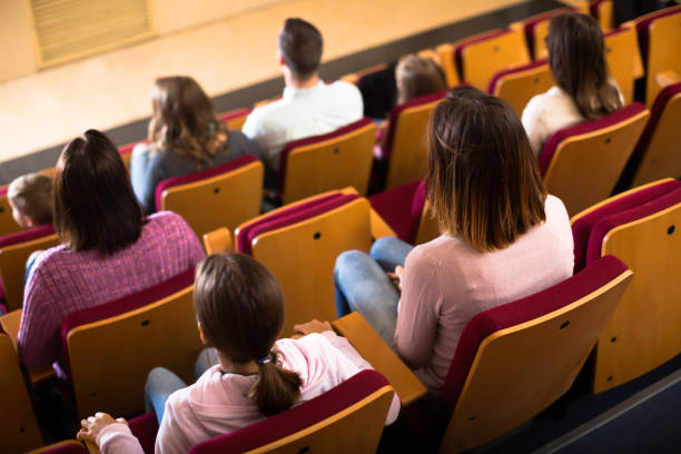 istock Ordinary audience expecting movie to begin 1008235296