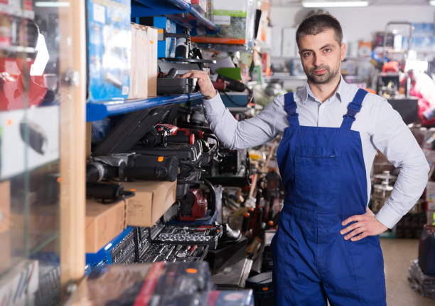 istock male near showcase with tools in the store 1008237952