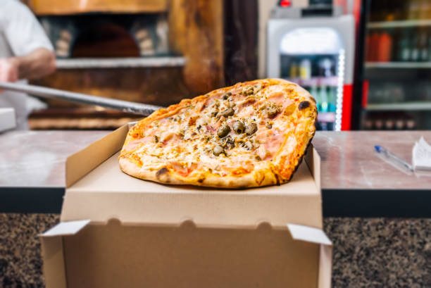 istock Freshly baked take away pizza. 1008238074