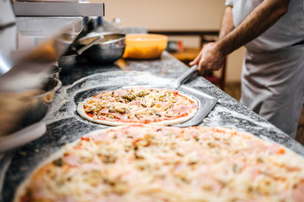 istock Raw pizza ready to be baked. 1008238110