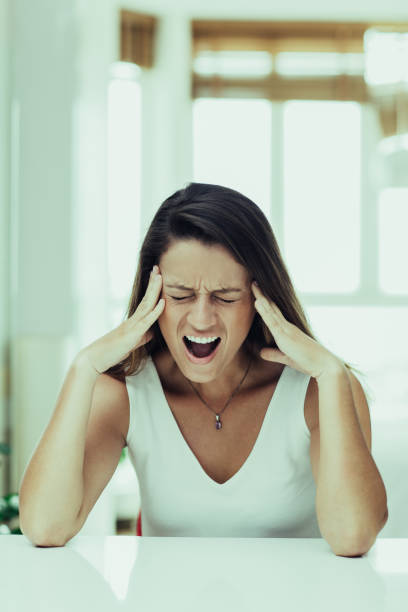 istock Stressful young woman crying from pain 1008254356