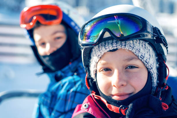 istock Little skiers on the ski lift 1008257210