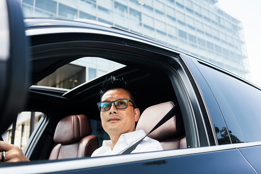 Chinese businessman at car
