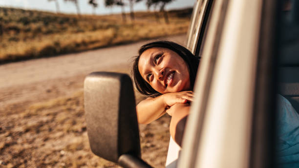 istock Smiling woman on a road trip 1008257640