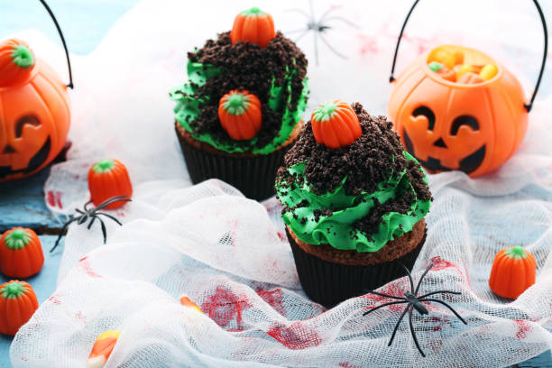 istock Halloween cupcakes on wooden table 1008259530