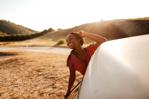 istock Happy, young woman on a road trip 1008262706