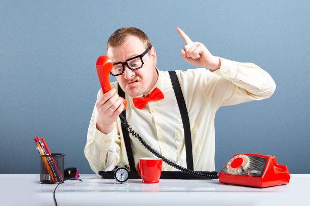 istock Angry businessman talking on phone 1008262962