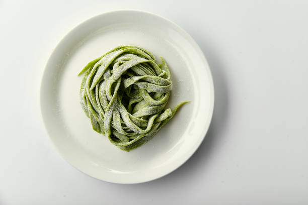 Green handmade italian tagliatelle pasta made with spinach