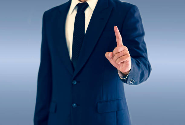 istock A businessman is standing and pointing hand. copy space for your text. 1008268812