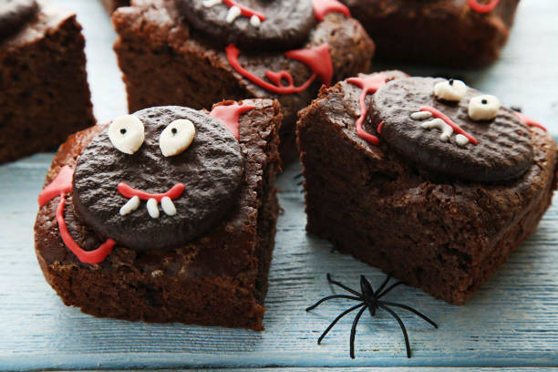 istock Fresh halloween cookies with spider on wooden table 1008271722