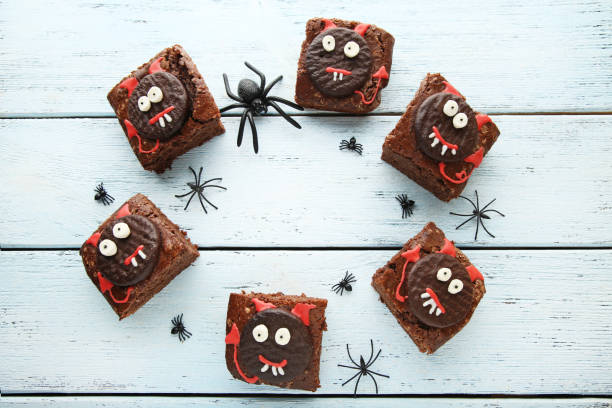 istock Fresh halloween cookies with spiders on wooden table 1008272062