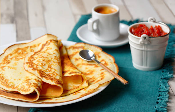 istock Pancakes with jam and Espresso on the wooden table 1008280908