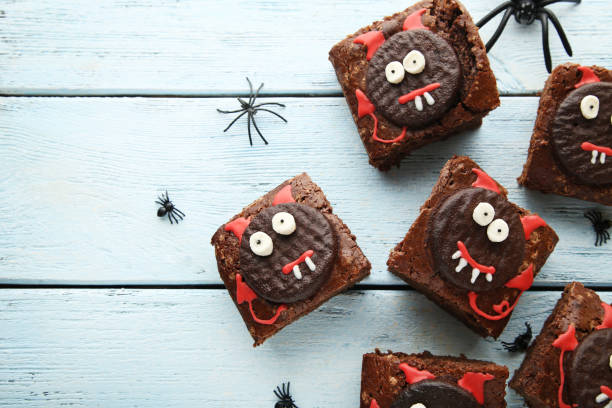 istock Fresh halloween cookies on white wooden table 1008280928