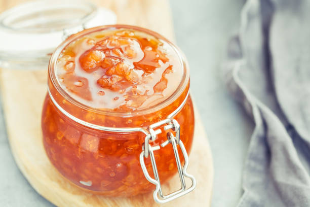 istock Glass jar with cloudberry jam. Nordic cuisine. 1008281184