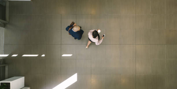 istock Business people walking together in lobby 1008284166