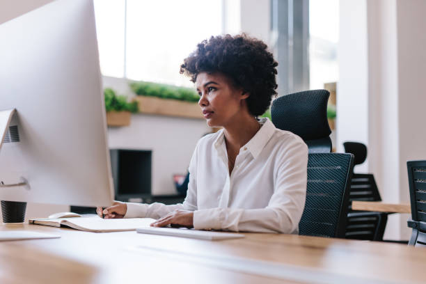 istock African woman working at her office desk 1008287086