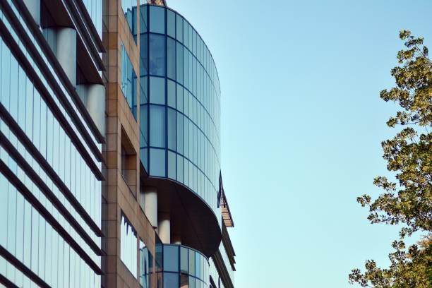 istock Blue clean glass wall of modern office building 1008287594