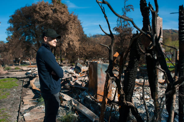 istock Man at ruins after fire disaster. 1008290158