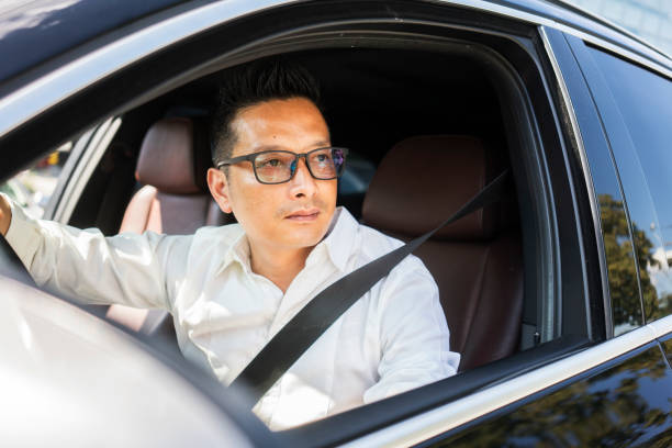 istock Chinese businessman draving a car 1008290968