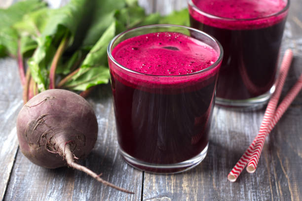 istock Freshly squeezed beet juice in glasses with fresh beets on a wooden table 1008297134