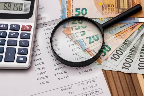 istock Purchase order with euro, magnifier and calculator 1008297276