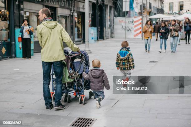 The Young Father Walks With His Children Stock Photo - Download Image Now - Father, Portugal, Baby - Human Age