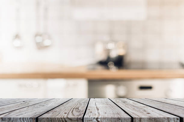 istock Wood table on blur Interior of kitchen background 1008320978