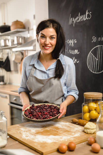 istock Woman preparingsweet pie in her kitchen 1008325316
