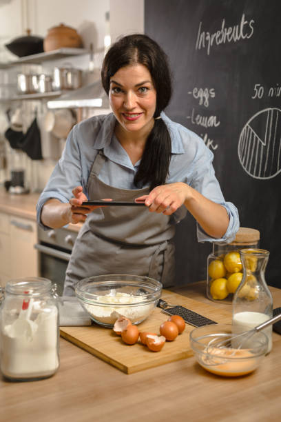 istock Woman preparingsweet pie in her kitchen 1008331630