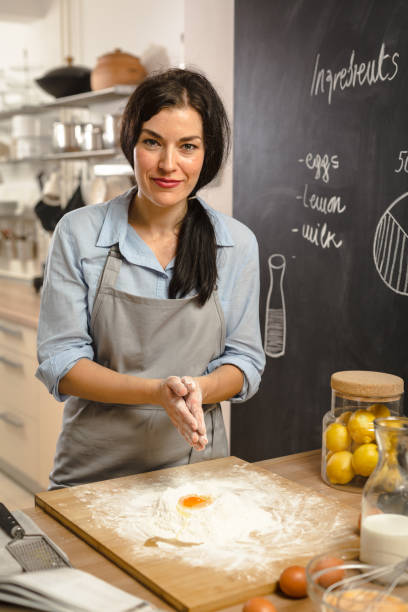 istock Woman preparingsweet pie in her kitchen 1008336148
