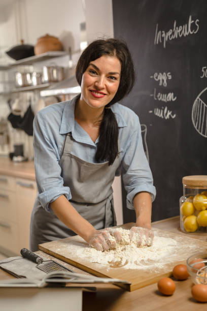 istock Woman preparingsweet pie in her kitchen 1008336224