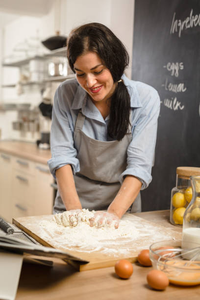 istock Woman preparingsweet pie in her kitchen 1008336226