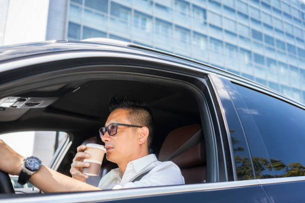 Chinese businessman draving a car
