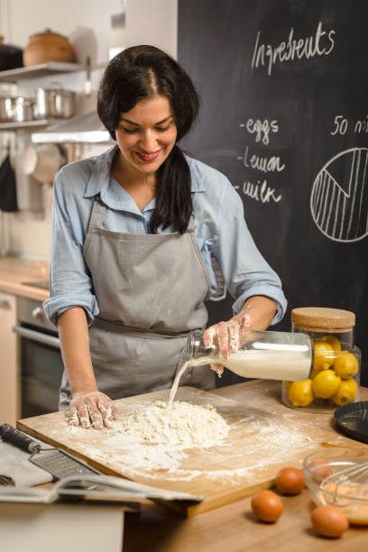 istock Woman preparingsweet pie in her kitchen 1008336336