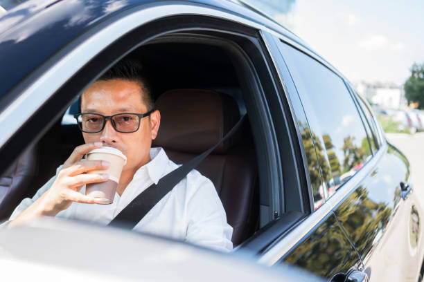 istock Chinese businessman draving a car 1008336378