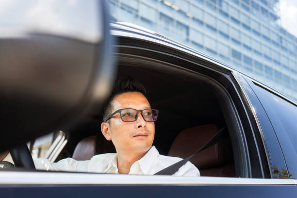 istock Chinese businessman draving a car 1008336382