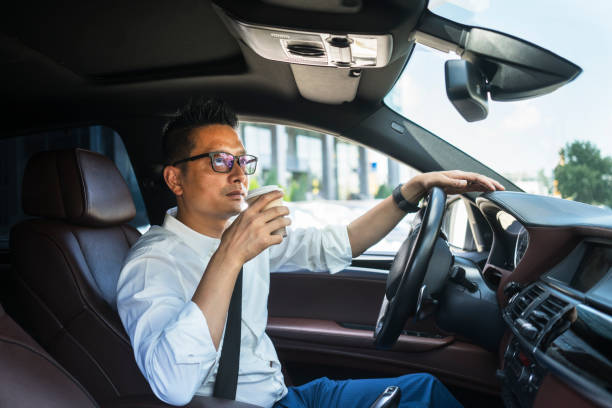 istock Chinese businessman draving a car 1008336820